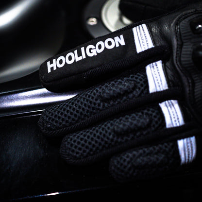 Black glove with 'Hooligoon' branding on a dark background