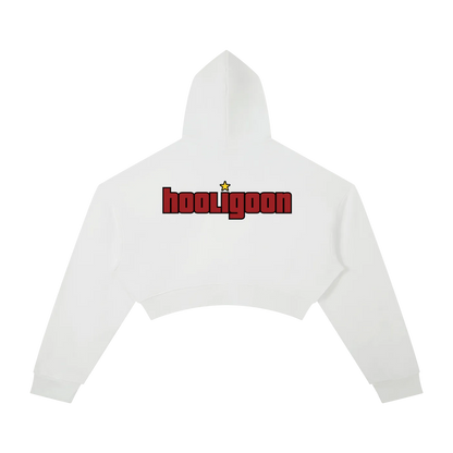 A white cropped hoodie shown from the back, featuring a red 'hooligoon' text graphic with a small yellow star above the 'o', on a plain white background.