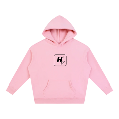 A light pink pullover hoodie with a black starburst logo and the word 'elevate' printed on the chest, displayed against a solid white background.