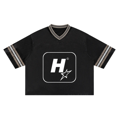 A black short-sleeve V-neck t-shirt with a large white graphic logo on the chest and striped detailing on the collar and sleeves, shown flat on a white background.